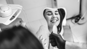 Woman Smiling in Dental Office